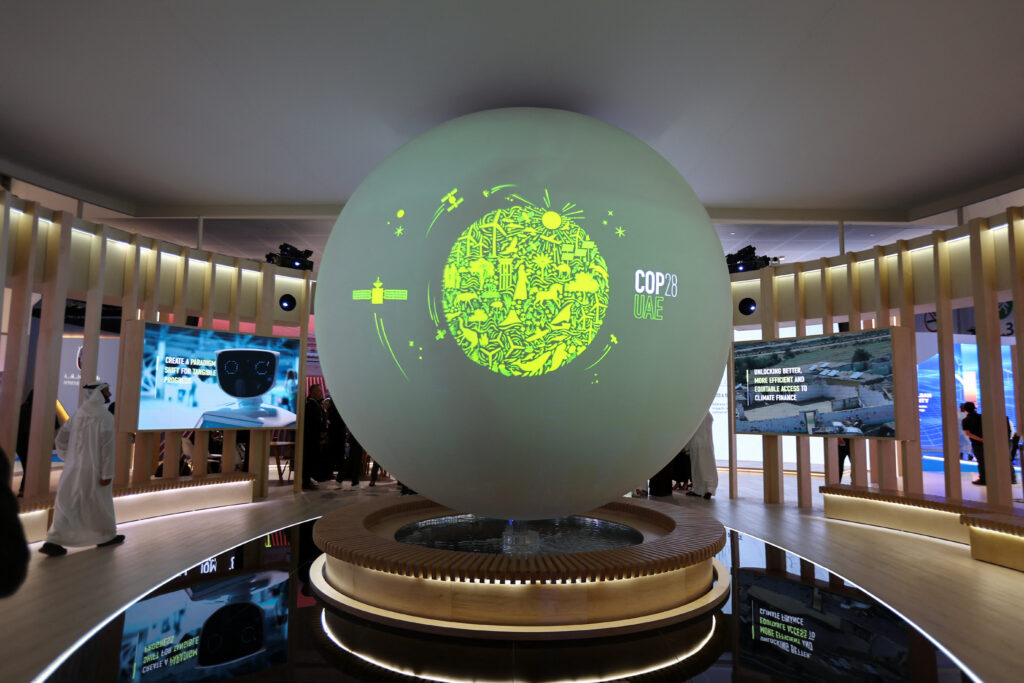 A View Shows The 'cop28 Uae' Logo On A Globe, During Abu Dhabi Sustainability Week (adsw), In Abu Dhabi